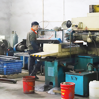 Skilled worker operating precision lathe machine